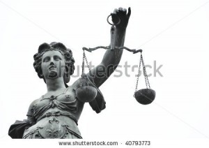 stock photo head and arm of a justice statue 40793773