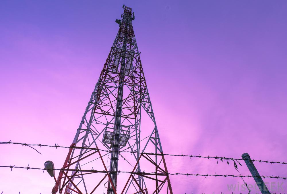 radio-tower-behind-barbed-wire-fence